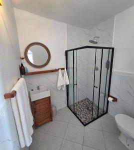 a bathroom with a shower and a sink at Cabana Beach Lodge in Cabo Conguiane +46 photos