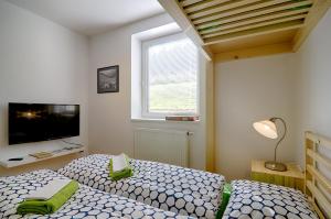 Postel nebo postele na pokoji v ubytování Apartmán Borůvka