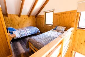 Postel nebo postele na pokoji v ubytování Cabañas Las Trancas El Shaddai