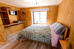 Postel nebo postele na pokoji v ubytování Cabañas Las Trancas El Shaddai