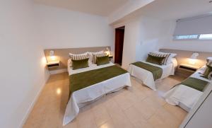 Postel nebo postele na pokoji v ubytování Hotel Estacion + 19 fotografií