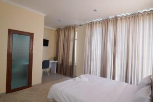 Ένα ή περισσότερα κρεβάτια σε δωμάτιο στο Labirint home +53 φωτογραφίες