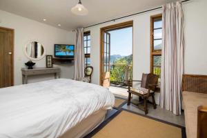 Ένα ή περισσότερα κρεβάτια σε δωμάτιο στο Bay View Retreat Queen Charlotte Drive