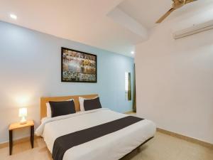 Giường trong phòng chung tại Super Townhouse Qualia Prime