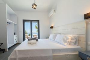 Кровать или кровати в номере Aphitriti Oxomeria +48 фотографий