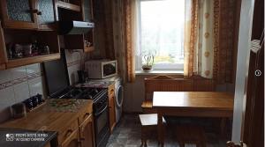 Kuchyň nebo kuchyňský kout v ubytování Apartamentas