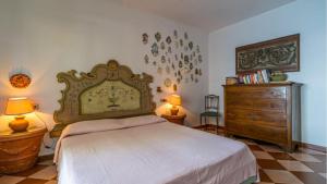 En eller flere senge i et værelse på Villa Il Tramonto Bordo Costa - Goelba