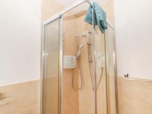 a shower with a glass door in a bathroom at 1 Windermere in Kinvara +31 photos