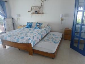 Ένα ή περισσότερα κρεβάτια σε δωμάτιο στο Casa del Mar