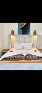 Postel nebo postele na pokoji v ubytování Amani Villa Zanzibar, Pwanimchangani