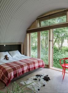 Кровать или кровати в номере Het Lage Noorden