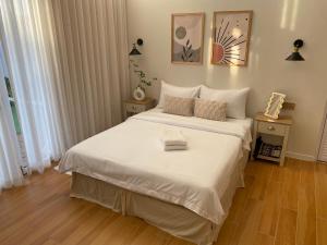 Postel nebo postele na pokoji v ubytování Sarang A Cottage with private pool + 26 fotografií