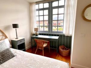 Ένα ή περισσότερα κρεβάτια σε δωμάτιο στο Apartamento Santa Ana