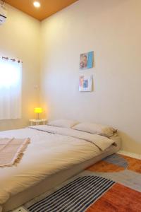 Giường trong phòng chung tại Nana pool villa Kanchanaburi +42 ảnh