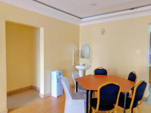 a dining room with a table and chairs at Grace bnb Marsabit in Marsabit