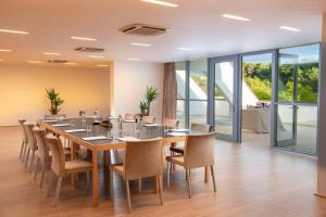 a large dining room with a table and chairs at Ethra Reserve Kalidria in Castellaneta Marina +25 photos