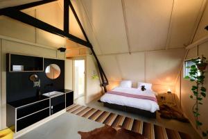 Postel nebo postele na pokoji v ubytování Het Lage Noorden