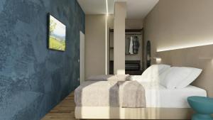 a bedroom with a white bed with a blue wall at Hotel Ristorante Dante in Torgiano +51 photos