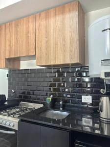 Køkken eller tekøkken på Moderno Loft - Piscina y solarium!