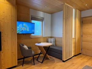 TV a/nebo společenská místnost v ubytování Hotel Damelis