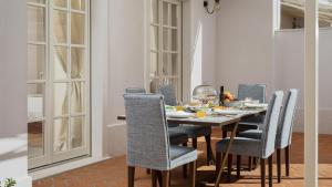 a dining room with a table and chairs at Luxury villa Adele with pool in Porec in Vabriga