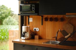 Η κουζίνα ή μικρή κουζίνα στο Villa Várzea - Barn Nest +16 φωτογραφίες