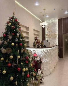 a christmas tree in the lobby of a store at The Palm hotel & spa in Almaty