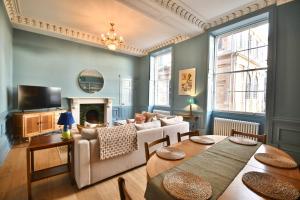 a living room with a couch and a table at 1 Purfleet Quay in King's Lynn