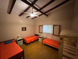 Ένα ή περισσότερα κρεβάτια σε δωμάτιο στο La Maguada