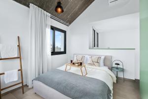 Ένα ή περισσότερα κρεβάτια σε δωμάτιο στο Pamboo Verdea House by Nomads