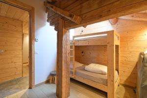 En eller flere senge i et værelse på Appartement Le Jalouvre