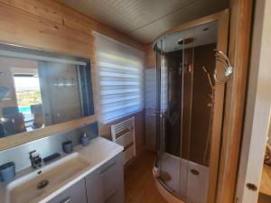 a bathroom with a shower and a sink at La tête sous les étoiles in Lézignan-la-Cèbe +31 photos