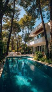a swimming pool in front of a house at Mây Hoa Tiên Villa - House in Da Lat