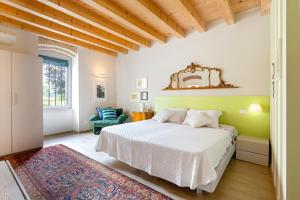 Una cama o camas en una habitación de Agriturismo Corte Patrizia 242 fotos más