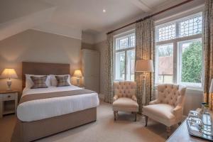 Ένα ή περισσότερα κρεβάτια σε δωμάτιο στο The Five Arrows Hotel