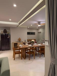 a kitchen and dining room with a table and chairs at CH Villa Travertine Stone in Ko Samui +1 photo