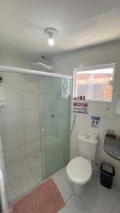 a bathroom with a shower and a toilet at NLC locações BonsVentos in Barreirinhas