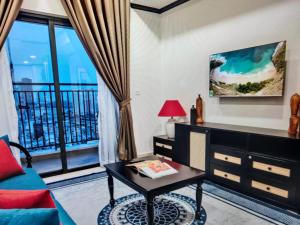 a living room with a couch and a table at The Levana Home Saigon in Ho Chi Minh City