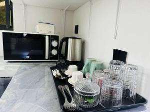 Η κουζίνα ή μικρή κουζίνα στο Emerald Garden Apartment +17 φωτογραφίες