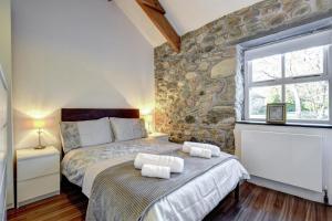 En eller flere senge i et værelse på 2 Bed in Caernarfon oc-76024