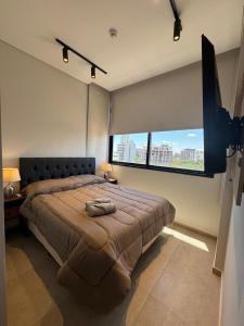 Postel nebo postele na pokoji v ubytování Edificio Torre Firenze Majestuoso