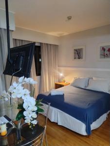 Postel nebo postele na pokoji v ubytování Hotel Slaviero Moema GrandFlats Suíte Master Luxo II