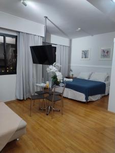 TV a/nebo společenská místnost v ubytování Hotel Slaviero Moema GrandFlats Suíte Master Luxo II