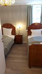 En eller flere senge i et værelse på BoLA Ferienwohnung Hamburg Nr 24 Shabby für 4 Personen, Parkplatz