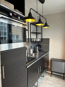 Køkken eller tekøkken på BoLA Ferienwohnung Hamburg 51 für 2 Personen