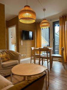 Et tv og/eller underholdning på BoLA Ferienwohnung Hamburg 50a mit Balkon Familienfreundlich für 4 Personen, Parkplatz + 13 billeder