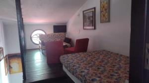 En eller flere senge i et værelse på Sua casa em Condominio proximo ao mar -ótima localização