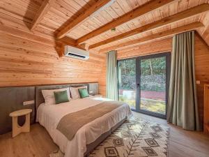 En eller flere senge i et værelse på Quinta do Ícaro - Nature Living