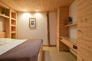 En eller flere senge i et værelse på Appartement Le Lachat