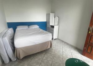 Postel nebo postele na pokoji v ubytování Casa FRENTE MAR Anchieta c/piscina e Área Goumert